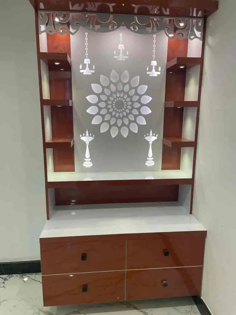 Pooja unit with a mandala glass panel, cut-work top and hanging lamp motifs